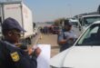 Police officers stop a motorist during the Operation Basadi roadblock on Olifantsfontein Road in Midrand on August 19, 2026. Photo: Comfort Makhanya