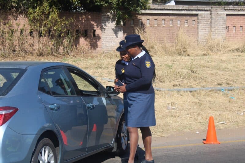 Police officers stop a motorist during the Operation Basadi roadblock on Olifantsfontein Road in Midrand on August 19. Photo: Comfort Makhanya