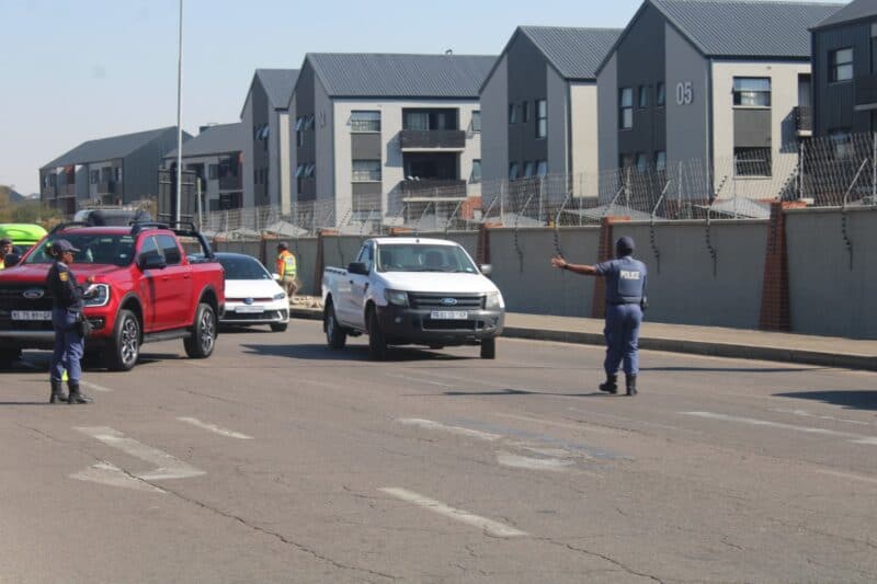 Officers stop motorists during a major Operation Basadi roadblock targeting crime and traffic violations in Midrand on August 19, 2026. Photo: Comfort Makhanya