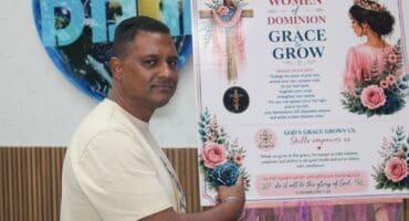Pastor Ashley Naidoo showcases the Grace to Grow poster during a discussion about the foundation’s community empowerment programmes on August 28. Photo: Comfort Makhanya