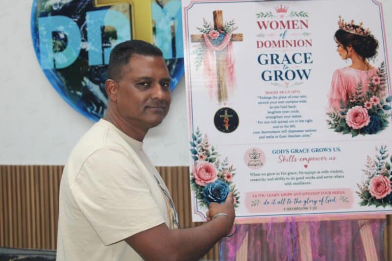 Pastor Ashley Naidoo showcases the Grace to Grow poster during a discussion about the foundation’s community empowerment programmes on August 28. Photo: Comfort Makhanya