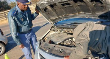Law-enforcement officials carry out checks during the latest Operation Shanela Two crackdown in Rabie Ridge on August 6. Photo: Supplied