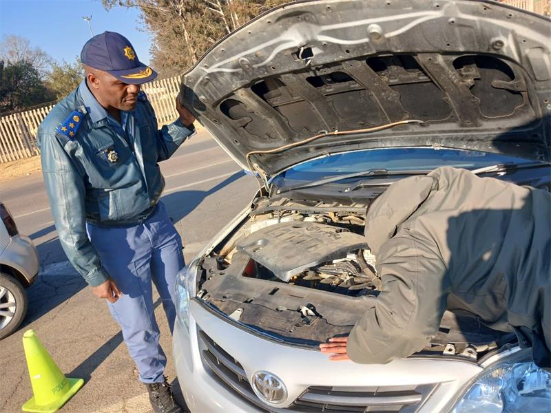 Law-enforcement officials carry out checks during the latest Operation Shanela Two crackdown in Rabie Ridge on August 6. Photo: Supplied