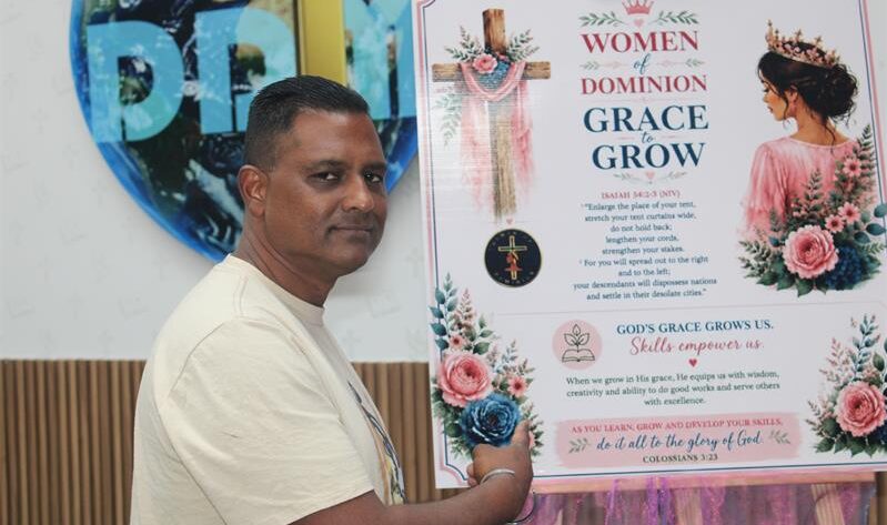 Pastor Ashley Naidoo showcases the Grace to Grow poster during a discussion about the foundation’s community empowerment programmes on August 28. Photo: Comfort Makhanya