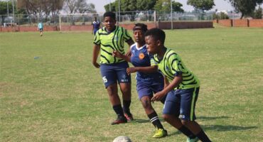 Waterfall Warriors FC’s player Phenyo Maroga in possession as Super Midrand’s Retshidisitswe Mokoena presses him while Pheletso Matlala watches on September 19. Photo Comfort Makhanya