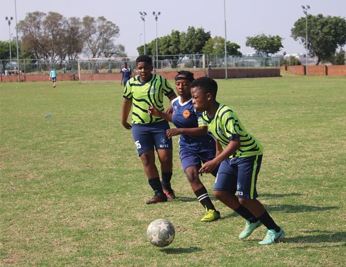 Waterfall Warriors FC’s player Phenyo Maroga in possession as Super Midrand’s Retshidisitswe Mokoena presses him while Pheletso Matlala watches on September 19. Photo Comfort Makhanya
