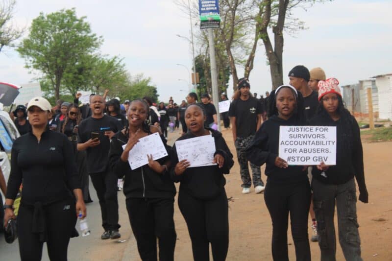 Residents gather with placards during the Rabie Ridge march, calling for an end to gender-based violence and femicide on September 20. Photo: Comfort Makhanya.