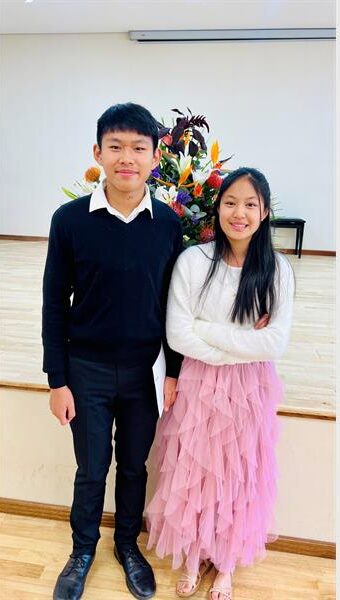 Beaulieu Preparatory School siblings Connor and Sienna Liu celebrate their success after both finishing second in their respective age categories at the Victoria K Bennett Music Competition. Photo: Supplied