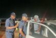 Law-enforcement officers inspect vehicles during the Operation Shanela 2 crackdown in Clayville on September 26. Photo: SAPS