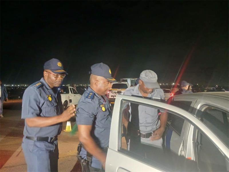 Law-enforcement officers inspect vehicles during the Operation Shanela 2 crackdown in Clayville on September 26. Photo: SAPS