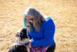 Dina-Vera Schmittknecht, BCR chairperson, plays with rescue border collie Jessie. Photo: Itumeleng Molefe