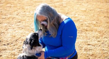 Dina-Vera Schmittknecht, BCR chairperson, plays with rescue border collie Jessie. Photo: Itumeleng Molefe