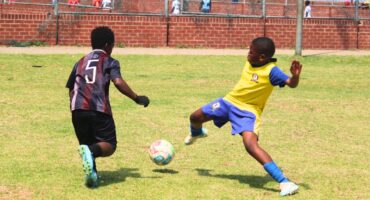 Njabulo Nhlengethwa takes on Nkulisa FC defender Mpho Matshuane during Phomolong United’s goalless encounter against Nkulisa in Rabie Ridge on October 10. Photo: Comfort Makhanya