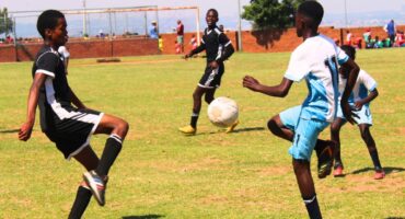 Somnyama Super United player Sive Mxabo and Mayibuye Development player Esihle Ludid compete for possession during their Midrand U15 League clash at Rabie Ridge Stadium on October 10. Photo: Comfort Makhanya