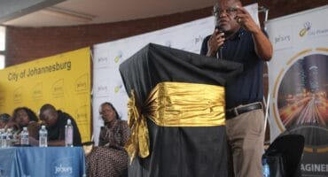 Dada Morero explains that the city will act decisively and repeatedly, promising it will continue until illegal networks are broken at the Rebie Ridge Community Hall on October 14, 2026. Photo: Itumeleng Molefe.