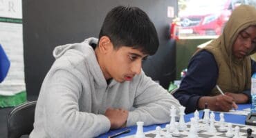 Arham Khalife concentrates on his next move during a chess game. Photo: Comfort Makhanya
