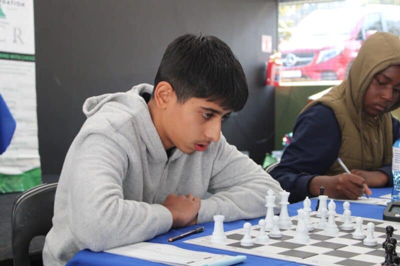 Arham Khalife concentrates on his next move during a chess game. Photo: Comfort Makhanya