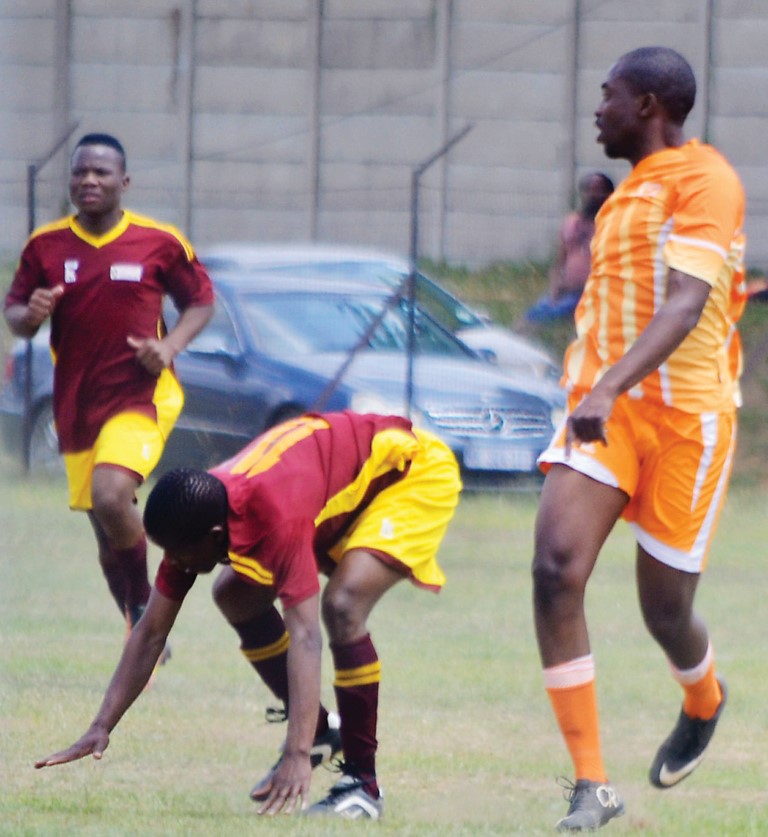 Image of football players on the field in Dundee.