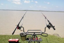 A photo of fishing rods and stands in front of the Ntshingwayo (Chelmsgford) Dam in KwaZulu-Natal.