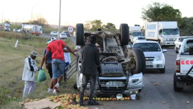 Apple van overturns
