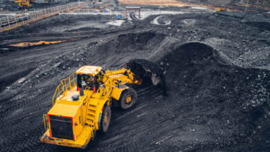 Coal mining at an open pit from above.