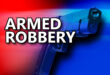 Armed robbery image with a gun.