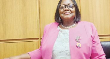 Image of Umzinyathi Mayor Thembisile Mchunu in a pink jacket.