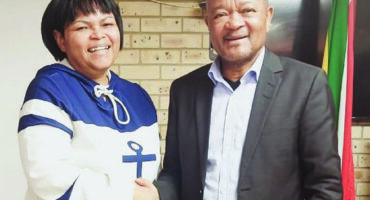 National Minister of Police, Sizwe Mchunu, encourages Major General Frances Slambert.