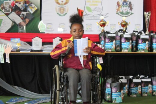 One of the young authors reading her submitted short story.