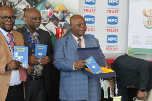 KZN Department of education officials proudly display the one of a kind book.