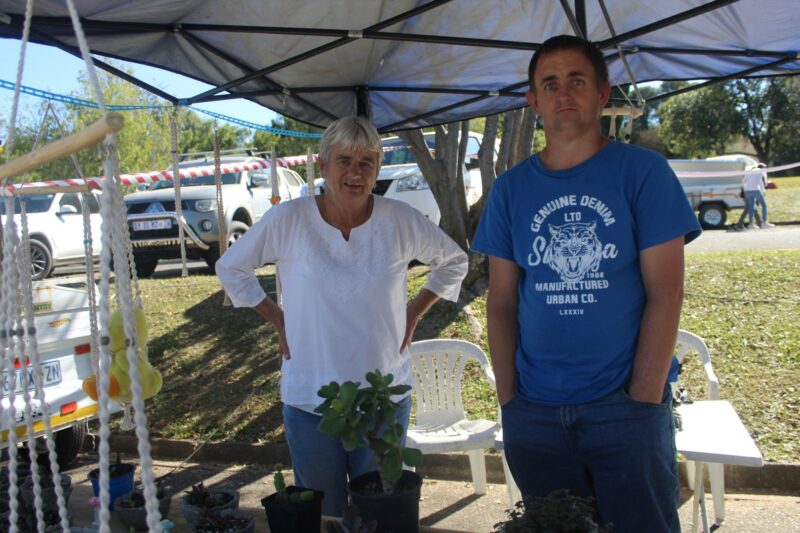 Ron and Steve of Ron's Plants pose in front of the stall at the Grace Market.