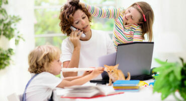 A picture of a working mom with her kids.