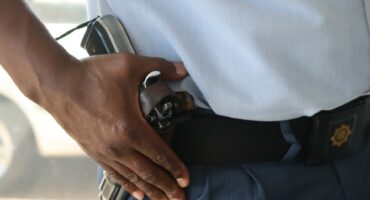 Policeman with a gun.