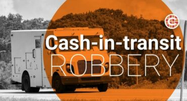 Caxton Cash-in-transit robbery stock image. Cash van in black and white with an orange circle with the wording.