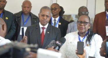 Minister of Co-operative Governance & Traditional Affairs Velenkosini Hlabisa and Umzinyathi District Mayor Thembisile Mchunu take questions from the Courier at the water summit held in Dundee. Mayor Mcebo Mkhize is seen in the background.