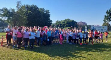 Photo of all the parkrun participants standing on grass.