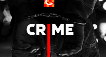 Caxton stock image for crime in black and white with hands handcuffed in the background.