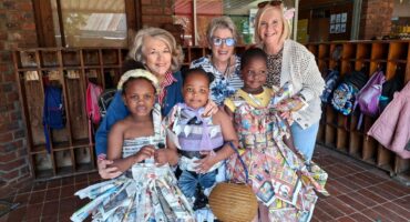 Photo of three Dundee teachers with Dundee Pre Primary children.