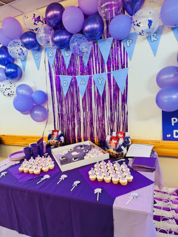 Purple and blue decorations and balloons and table decorations to celebrate World Prematurity Day.