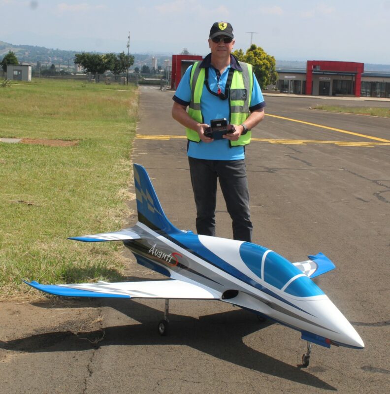 A model aircraft pilots checking his plane at the Newcastle Airport.