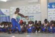 Image of Mthashana College students singing and dancing to Ingoma which is a Zulu traditional dance.