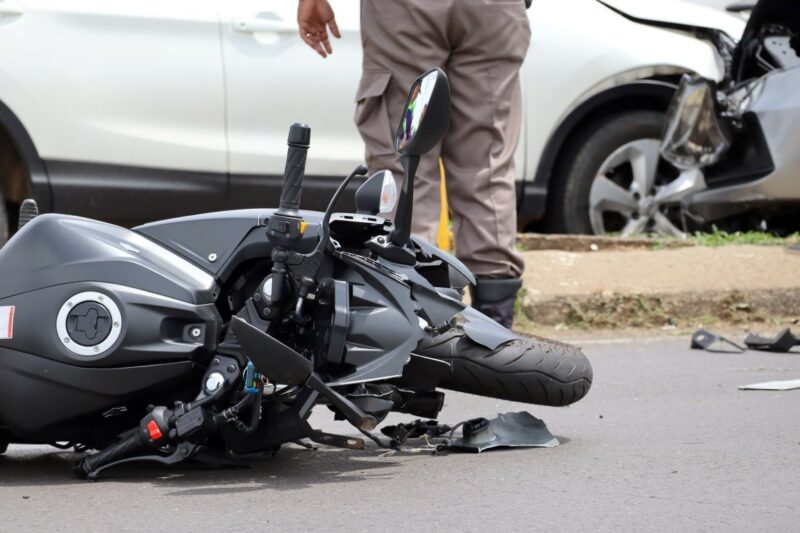 A motorbike ride was left seriously injured in a collision, with a traffic cop seen in the background.