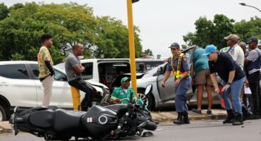 A motorbike ride was left seriously injured in a collision involving two motorvehicles