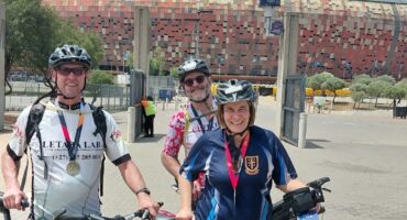 Paul Steffensen and family at the Joburg Cycle race holding bikes and wearing cycling gear.