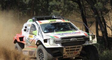 Image of Castrol NWM Ford Rally Raid Evo Plus car flying over dusty road.