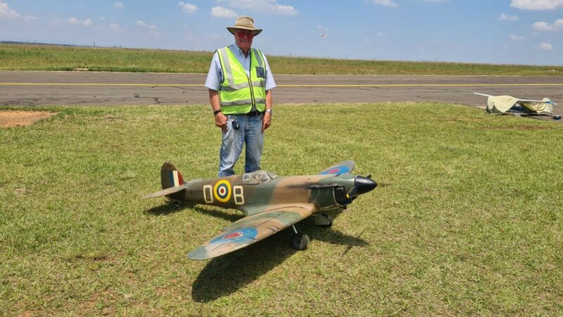 A model aircraft pilots checking his plane at the Newcastle Airport.