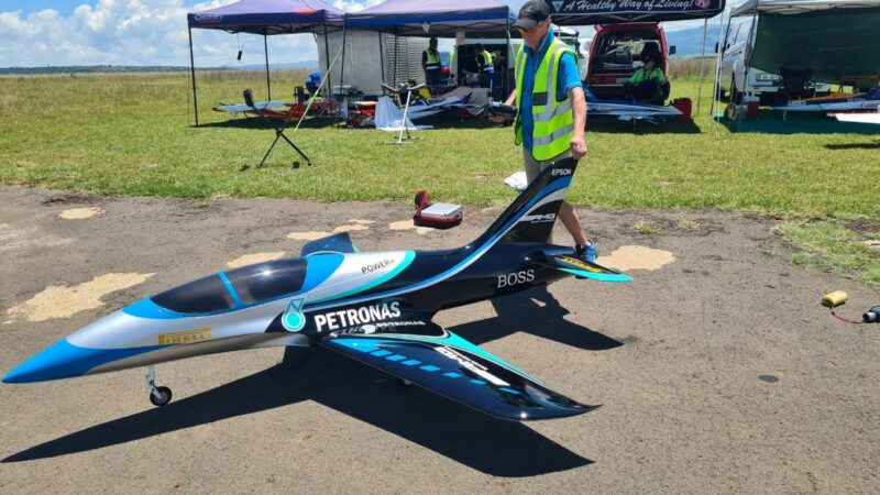 A model aircraft pilots checking his plane at the Newcastle Airport.