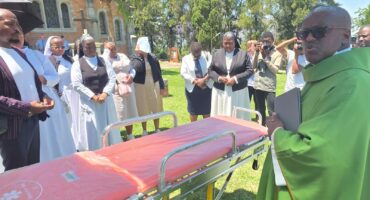 Image of staff of Duduza Care Centre celebrating the donation of an ambulance from the Japanese Embassy.