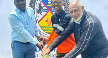 Image of Endumeni Mayor Mkhize and officials turning a sod to launch a road repair project.