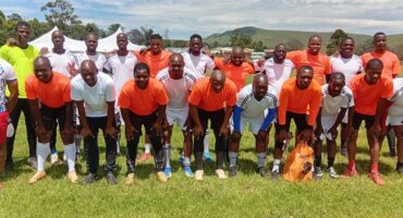 A group image of football players at Coronation Sport Field, after playing for charity, in support of learners in need.
